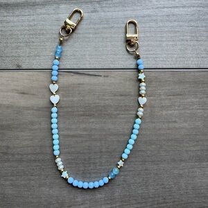 Blue and Gold Phone Strap with Elegant Design